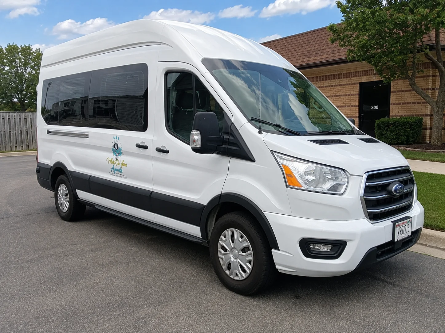 The What's On Your Agenda Ford Transit 350 passenger van in Milwaukee.